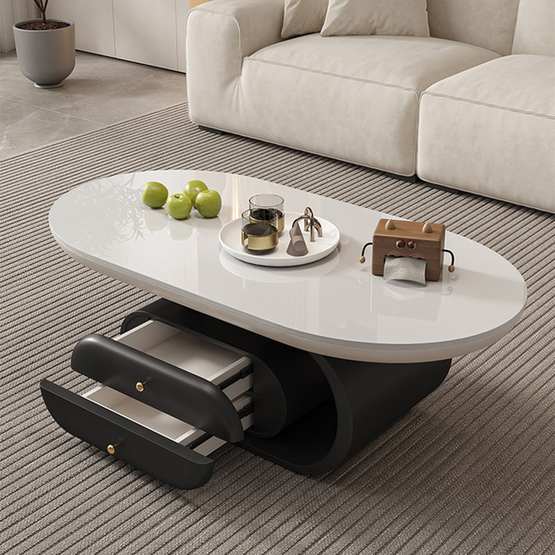 Orren Ellis Oval-shaped rock plate coffee table living room